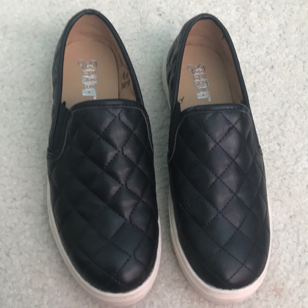 Black Slip ons.